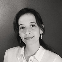 A greyscale photograph of Mariana Gil PhD